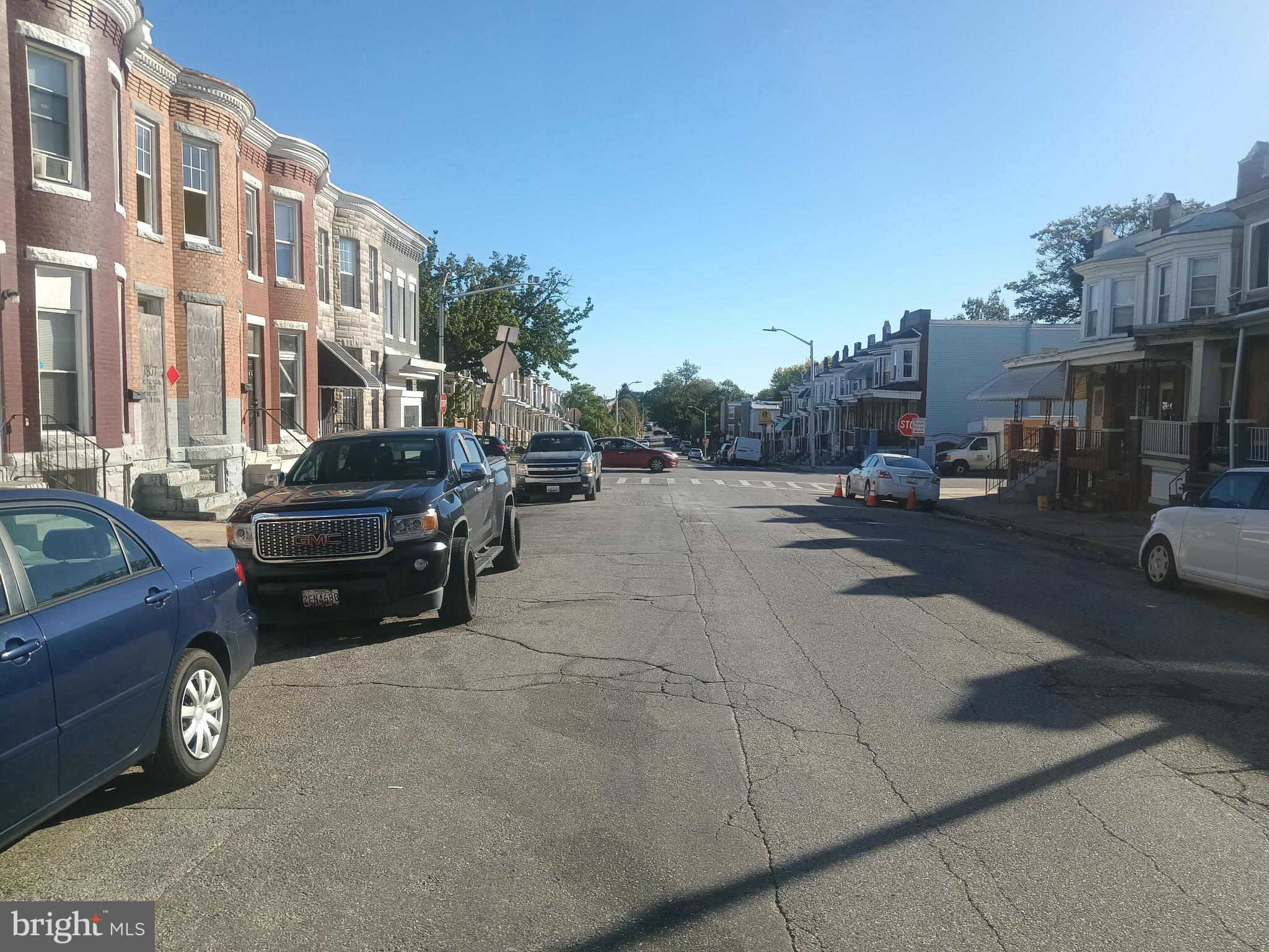 1815 North Pulaski Street Baltimore, MD 21217 - Photo 3 of 3 a view of a cars park in front of a building