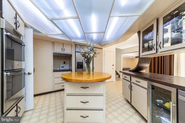 a kitchen with stainless steel appliances granite countertop a sink and cabinets