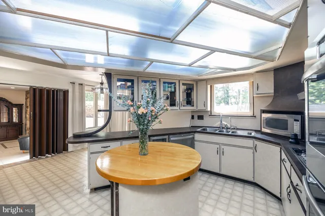 a kitchen with stainless steel appliances granite countertop a stove and a refrigerator