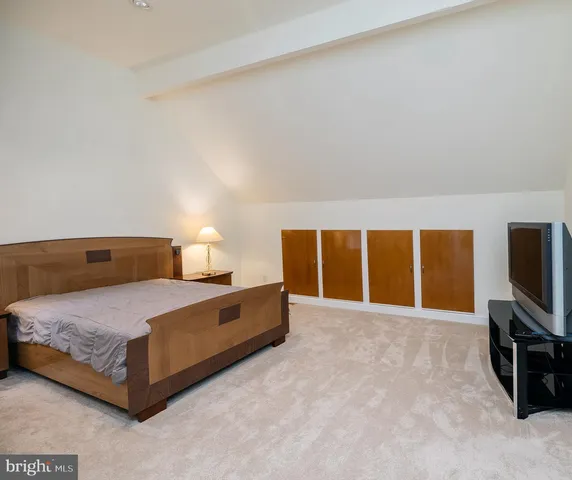 a room with a dresser and a mirror