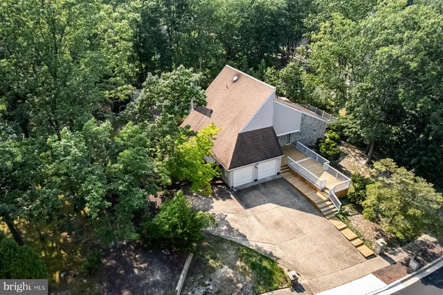 a view of a backyard with sitting area