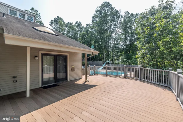 an aerial view of a house with garden space and street view