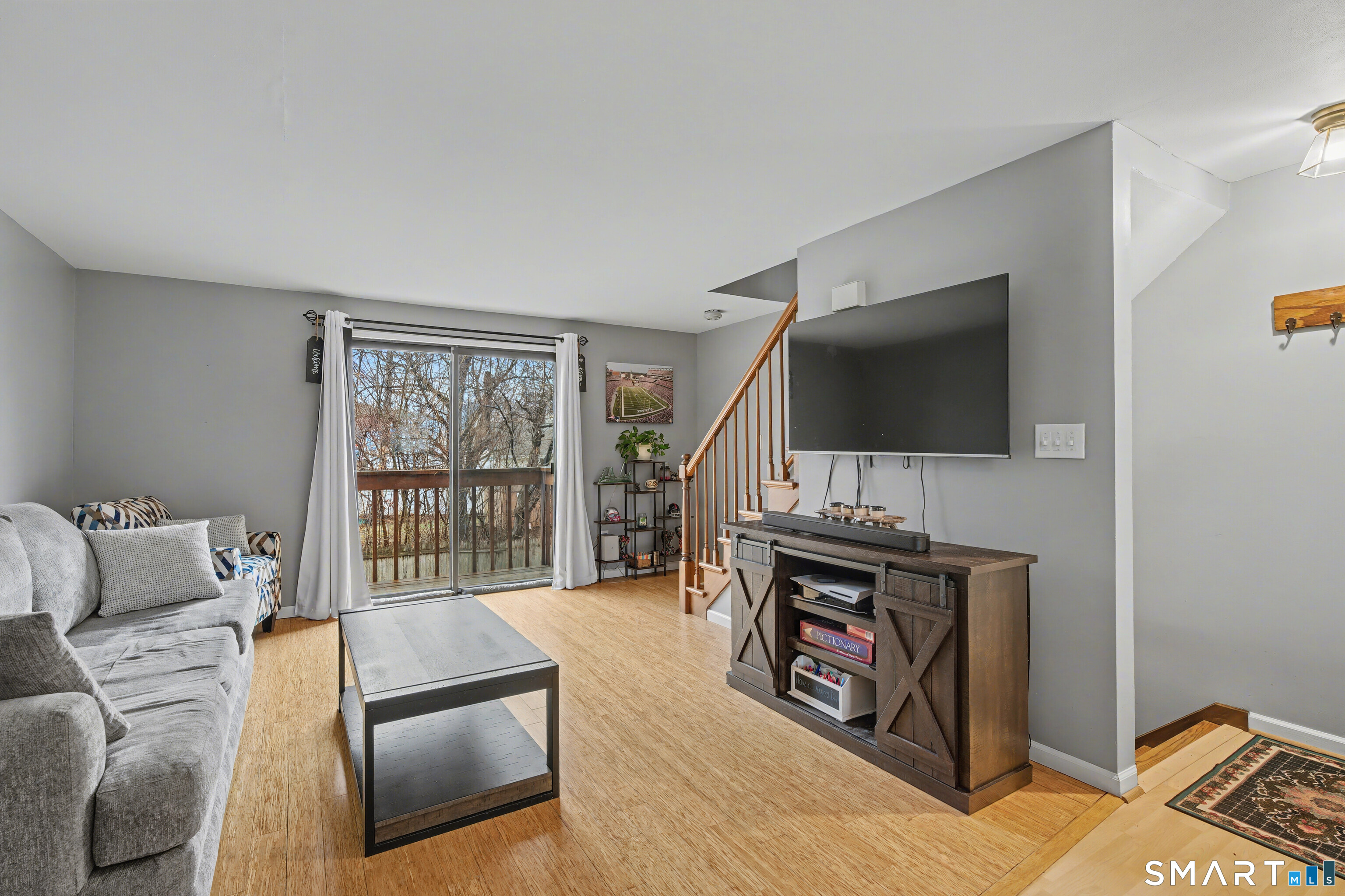 a living room with furniture and a flat screen tv
