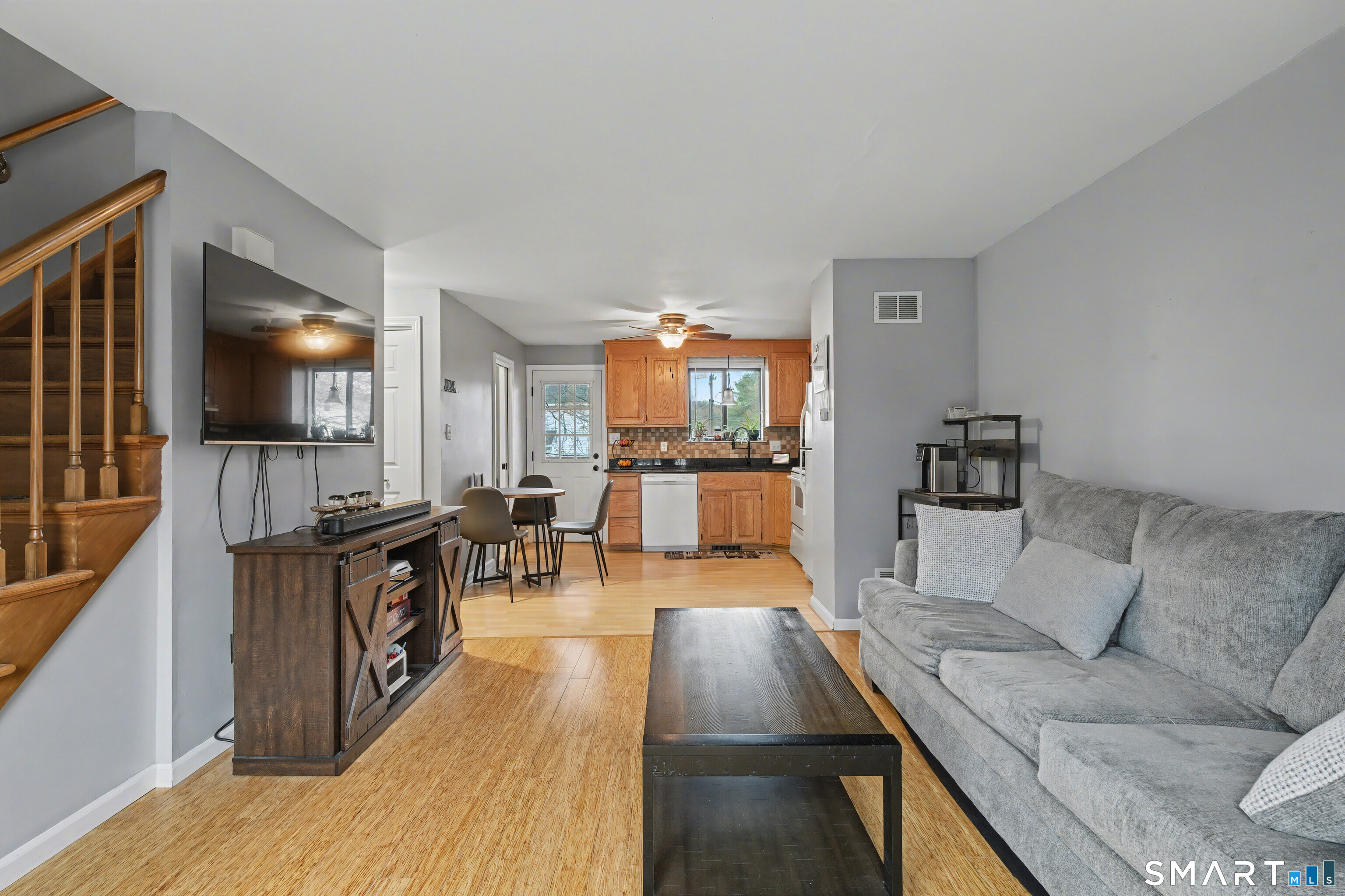 120 West Main Street, Unit 206 Meriden, CT 06451 - Photo 15 of 37 a living room with furniture and a flat screen tv