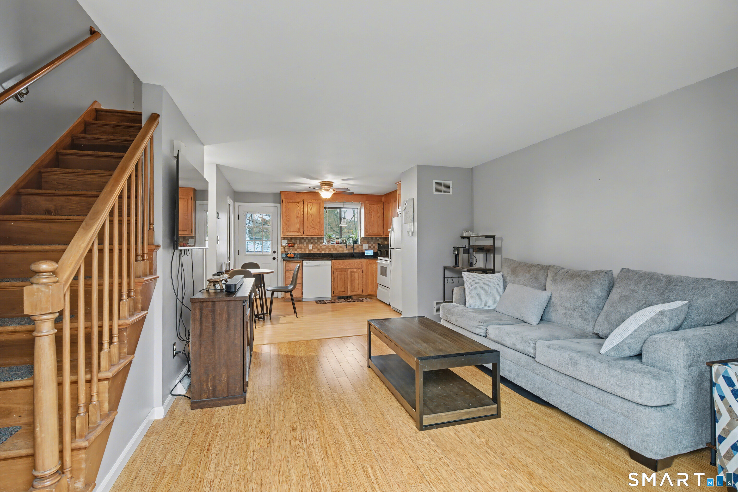 120 West Main Street, Unit 206 Meriden, CT 06451 - Photo 16 of 37 a living room with furniture and a wooden floor