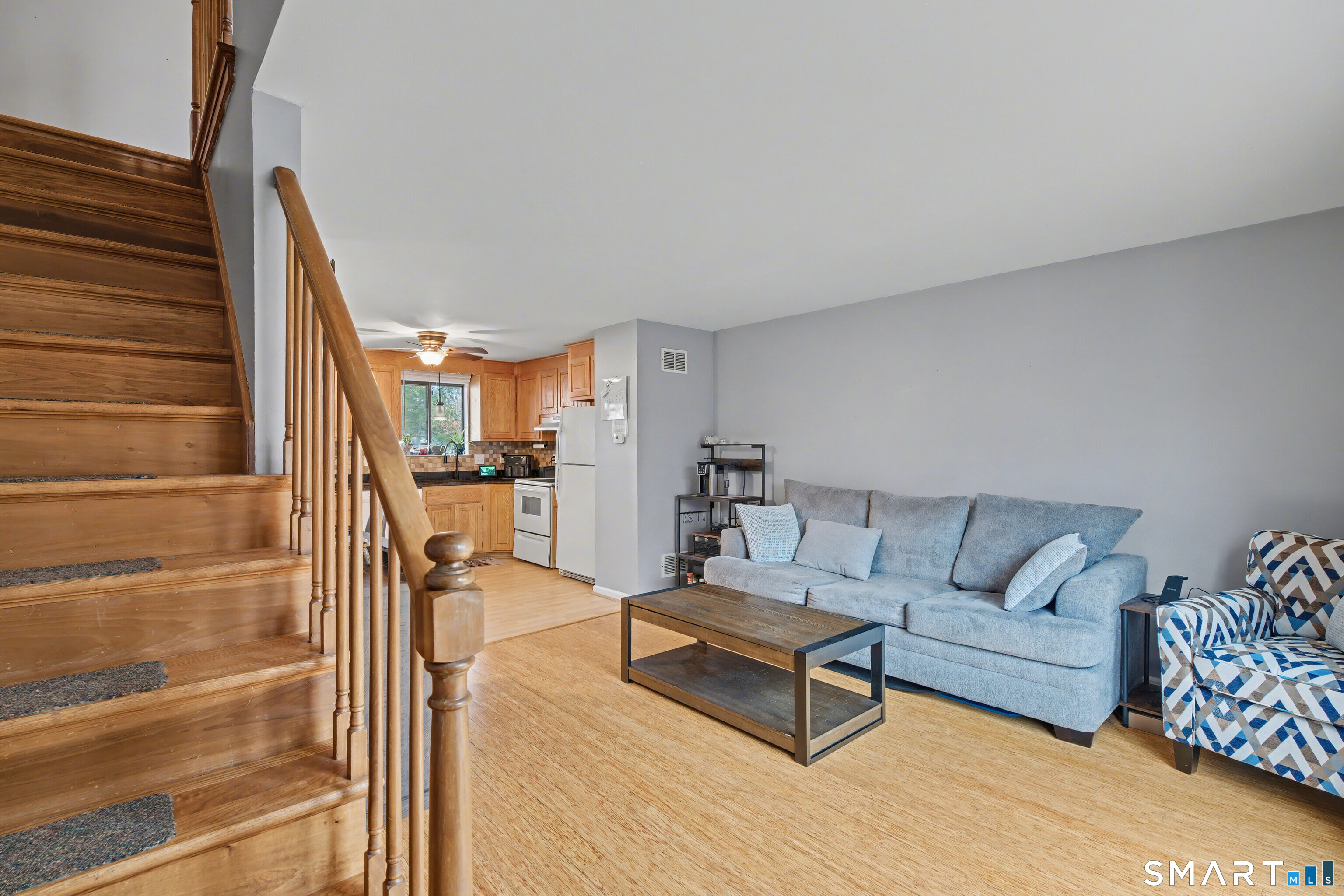 120 West Main Street, Unit 206 Meriden, CT 06451 - Photo 17 of 37 a living room with furniture and a fireplace