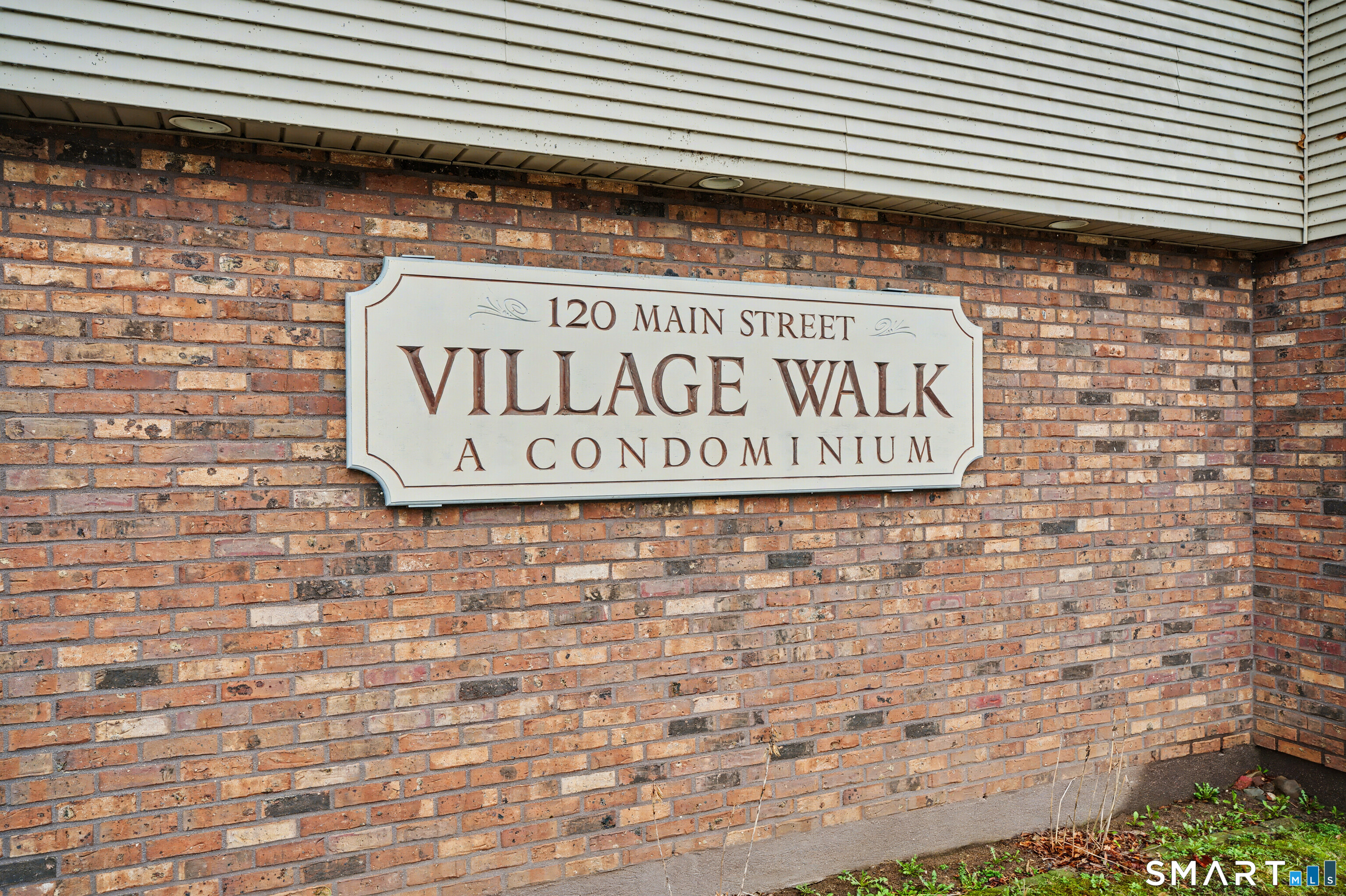 120 West Main Street, Unit 206 Meriden, CT 06451 - Photo 30 of 37 a sign on the brick wall