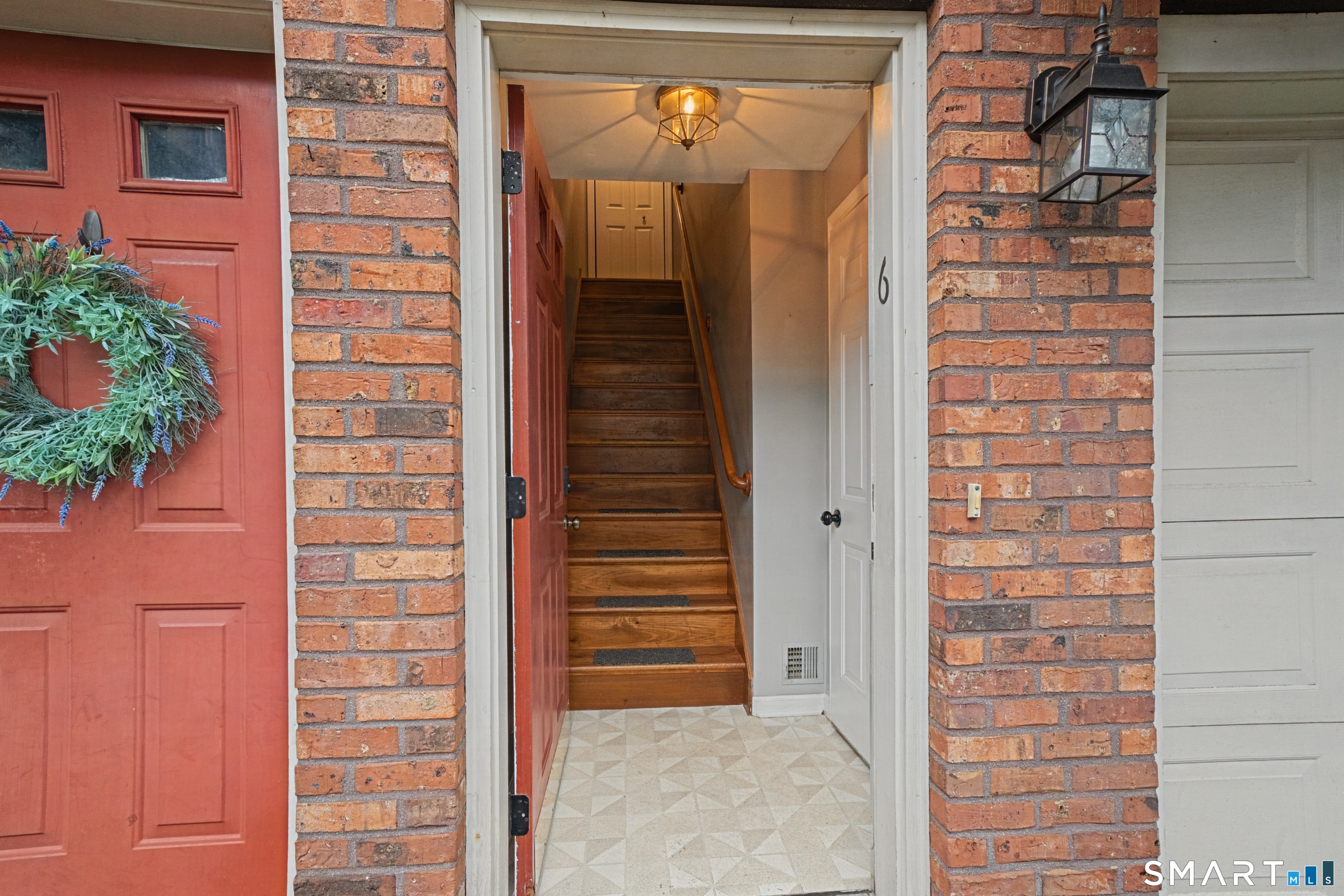 120 West Main Street, Unit 206 Meriden, CT 06451 - Photo 3 of 37 a view of front door of house and stairs