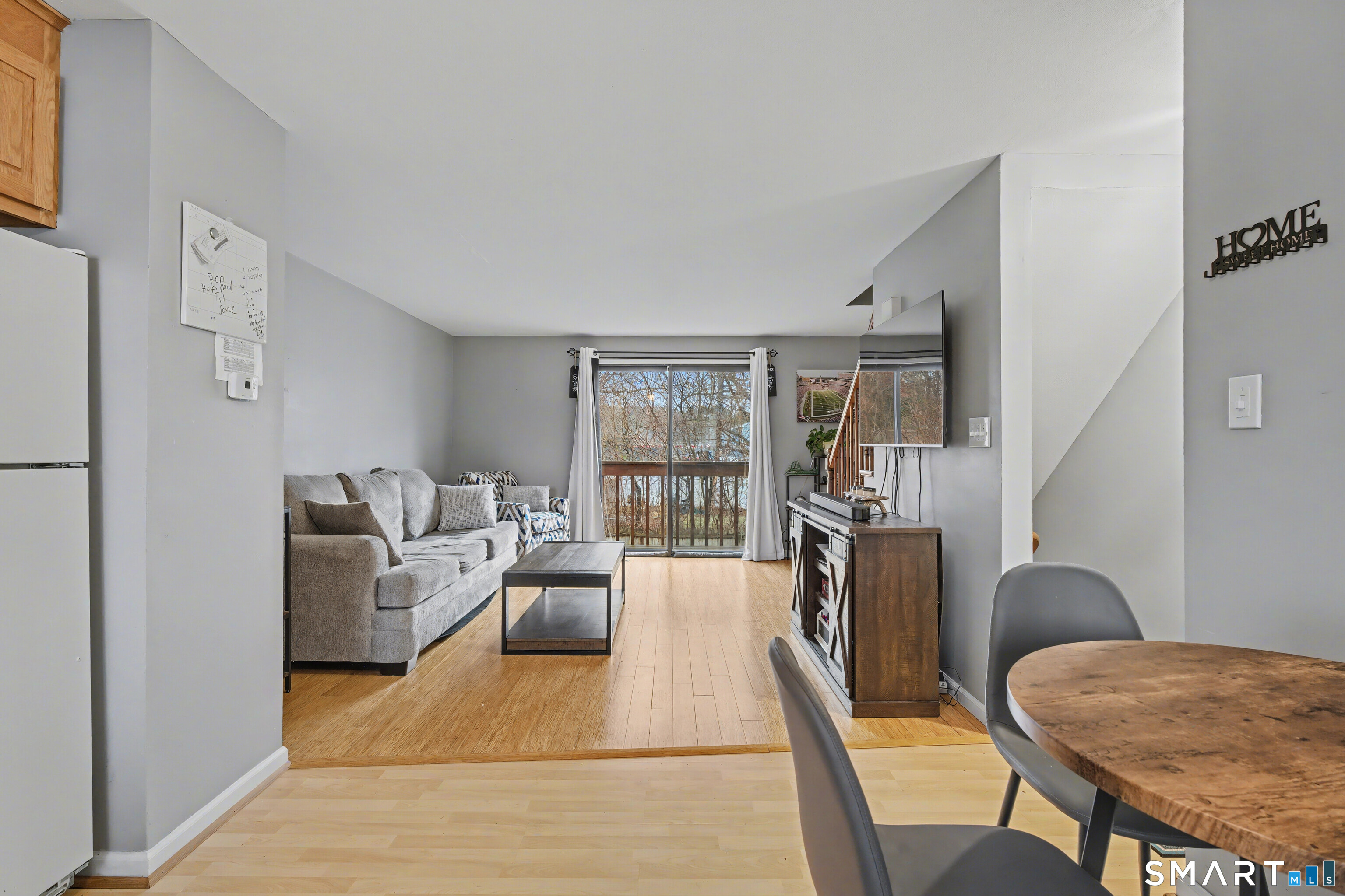 120 West Main Street, Unit 206 Meriden, CT 06451 - Photo 6 of 37 a living room with furniture a rug and a table