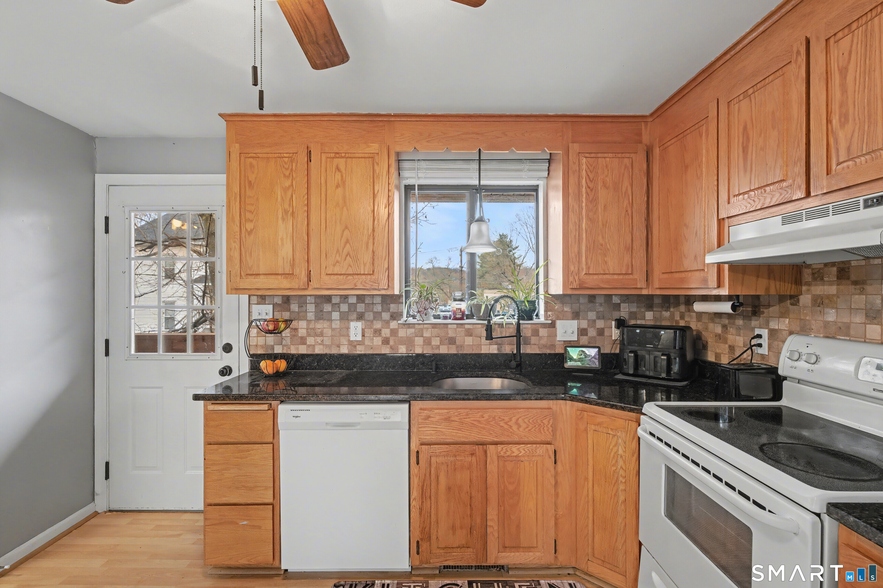 120 West Main Street, Unit 206 Meriden, CT 06451 - Photo 10 of 37 a kitchen with stainless steel appliances granite countertop a stove a sink and white cabinets