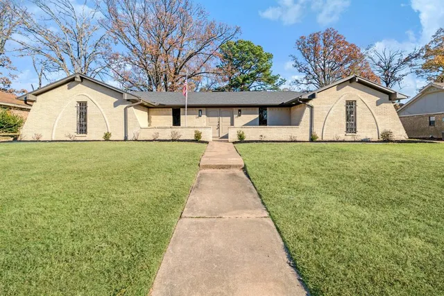 a front view of a house with yard