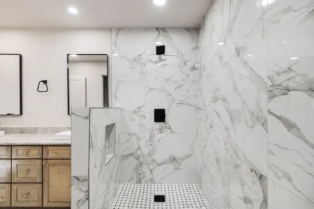 a bathroom with a sink and a mirror