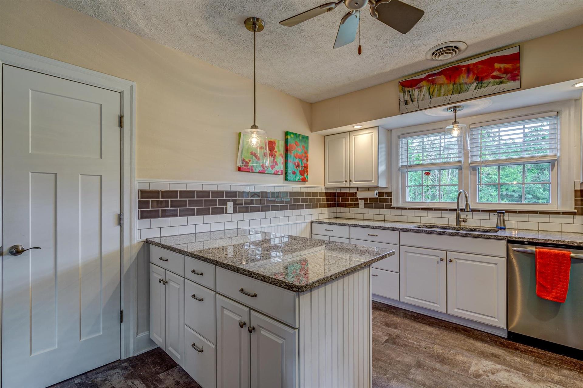 279 Morgans Fork Road, Unit 301 Penhook, VA 24137 - Photo 8 of 52 a kitchen with granite countertop a sink and a window