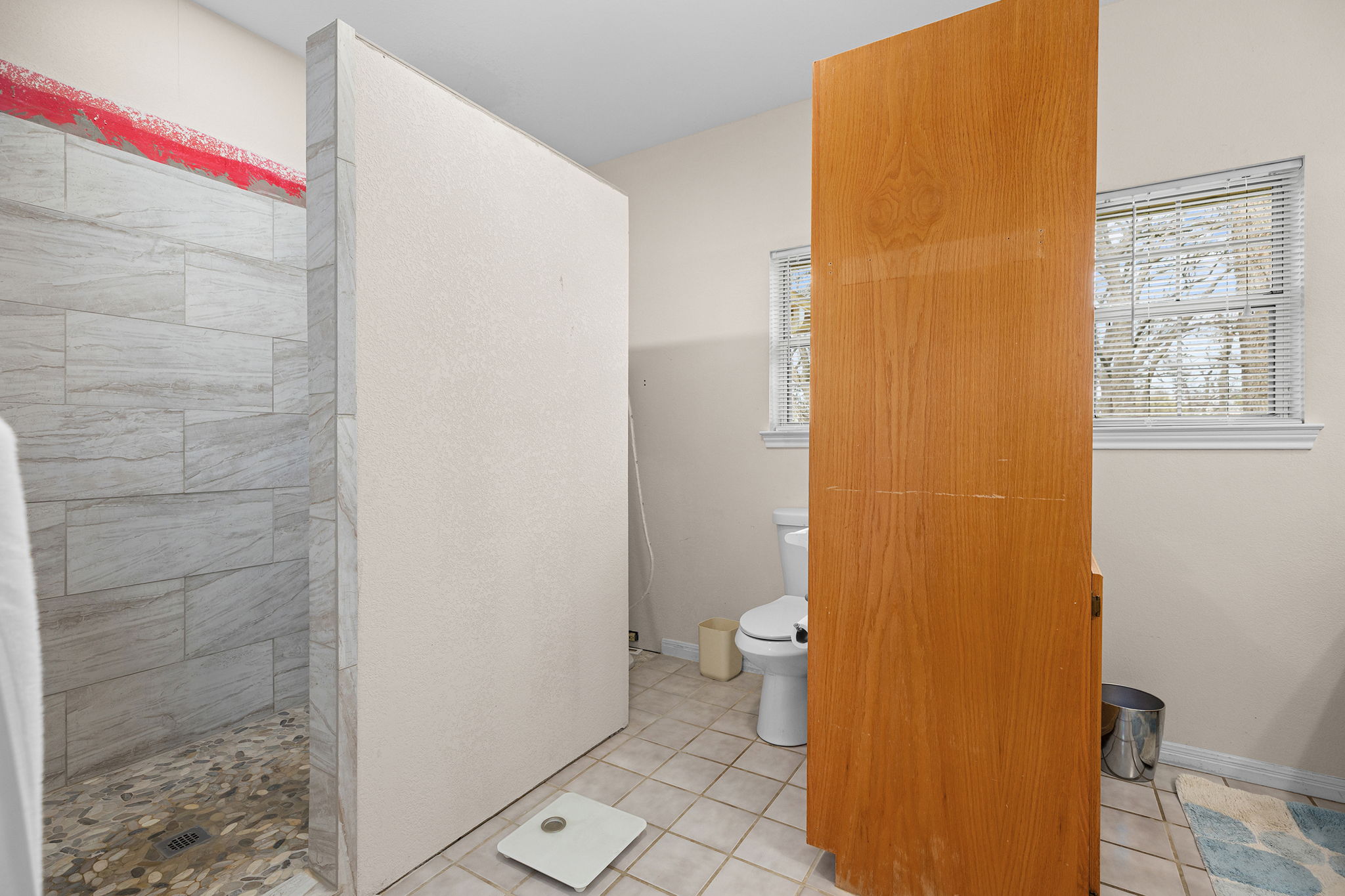 75 County Road 129 Taylor, TX 76574 - Photo 11 of 40 Bathroom with a walk in shower and light tile patterned flooring