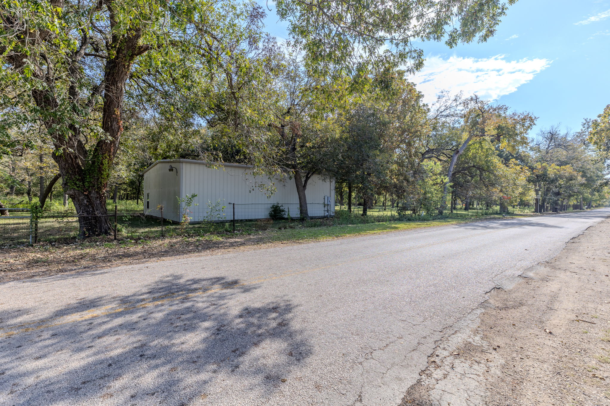 75 County Road 129 Taylor, TX 76574 - Photo 37 of 40 View of asphalt street with view of scattered trees