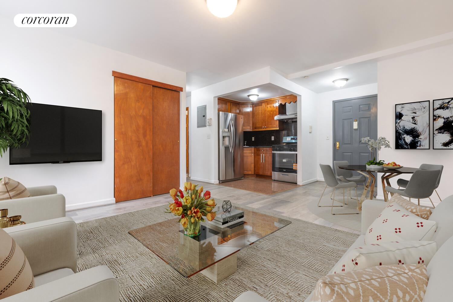 132-36 Pople Avenue, Unit BA Queens, NY 11355 - Photo 3 of 9 a living room with furniture and a flat screen tv