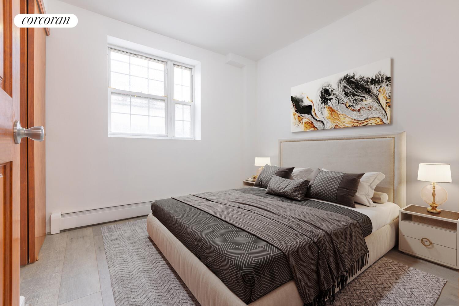 132-36 Pople Avenue, Unit BA Queens, NY 11355 - Photo 7 of 9 a bedroom with bed and painting on the wall