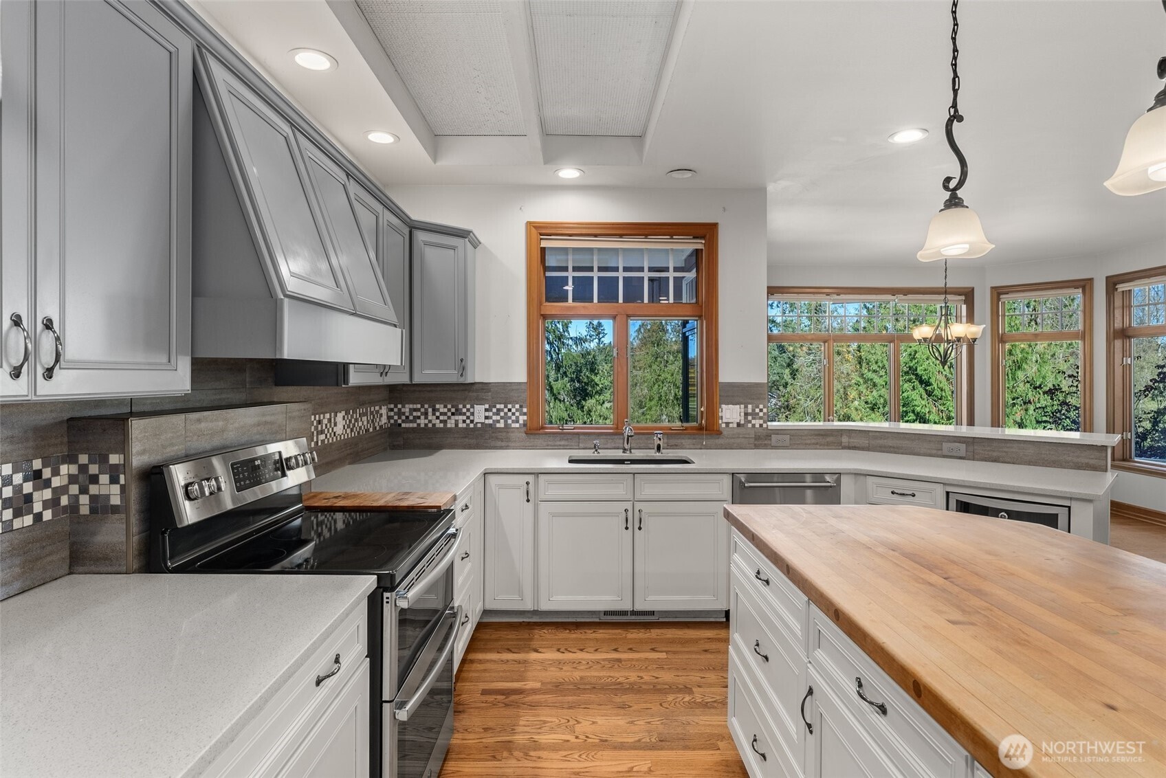 153 A Walhaupt Road Onalaska, WA 98570 - Photo 12 of 38 a kitchen with a sink stove and cabinets