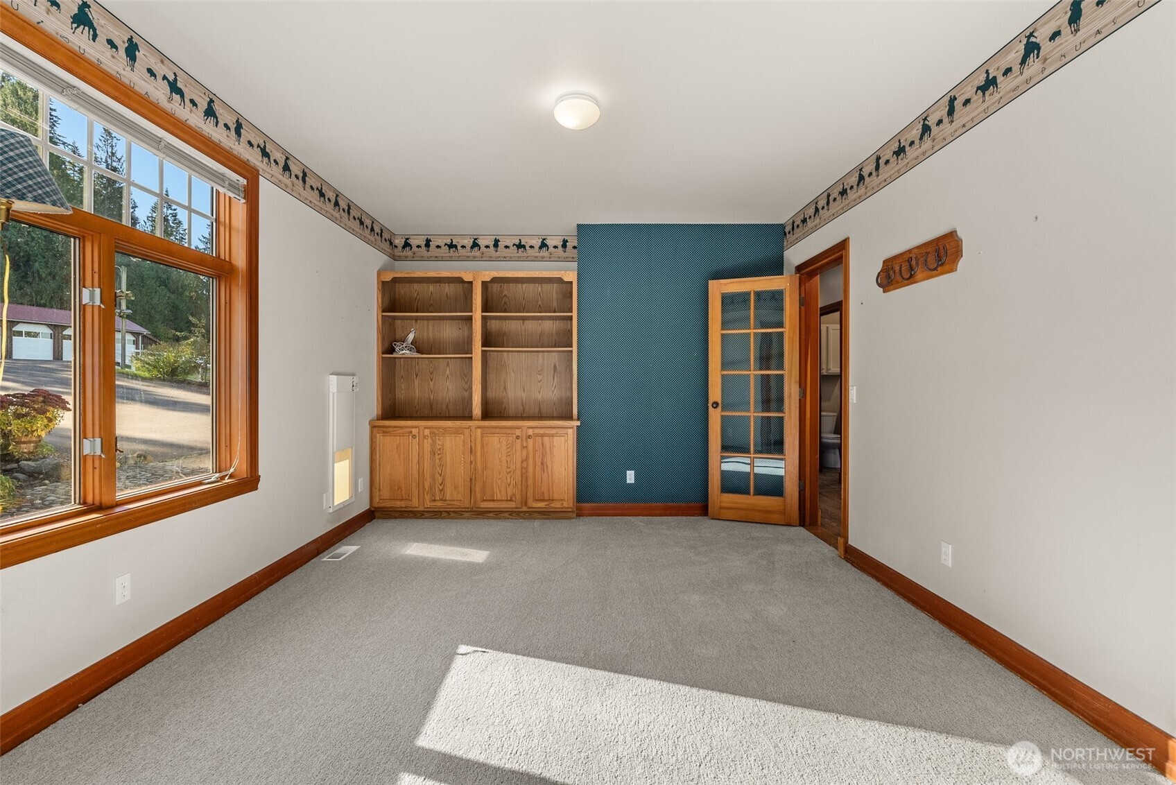 153 A Walhaupt Road Onalaska, WA 98570 - Photo 14 of 38 a view of an empty room with glass door