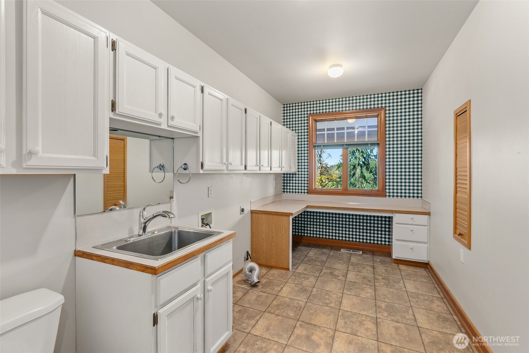153 A Walhaupt Road Onalaska, WA 98570 - Photo 20 of 38 a kitchen with a sink cabinets and window