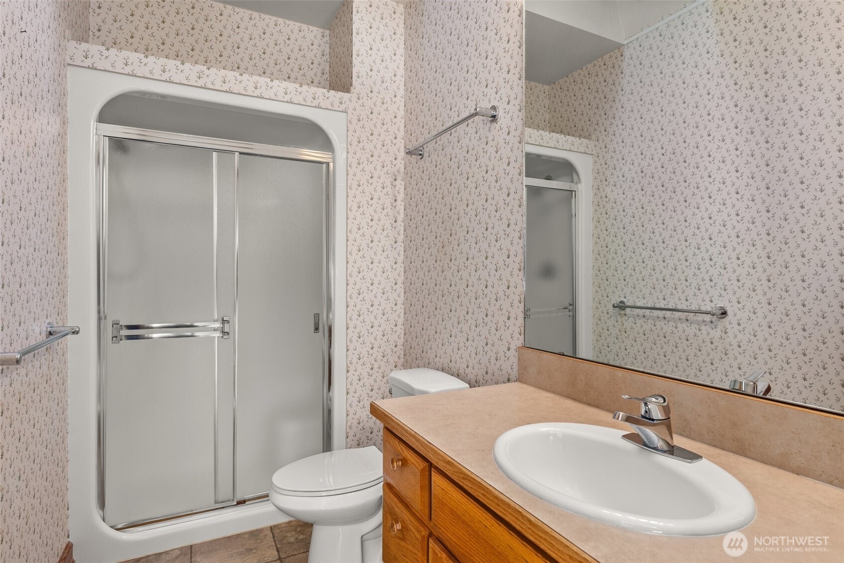153 A Walhaupt Road Onalaska, WA 98570 - Photo 23 of 38 a bathroom with a sink a toilet and a mirror