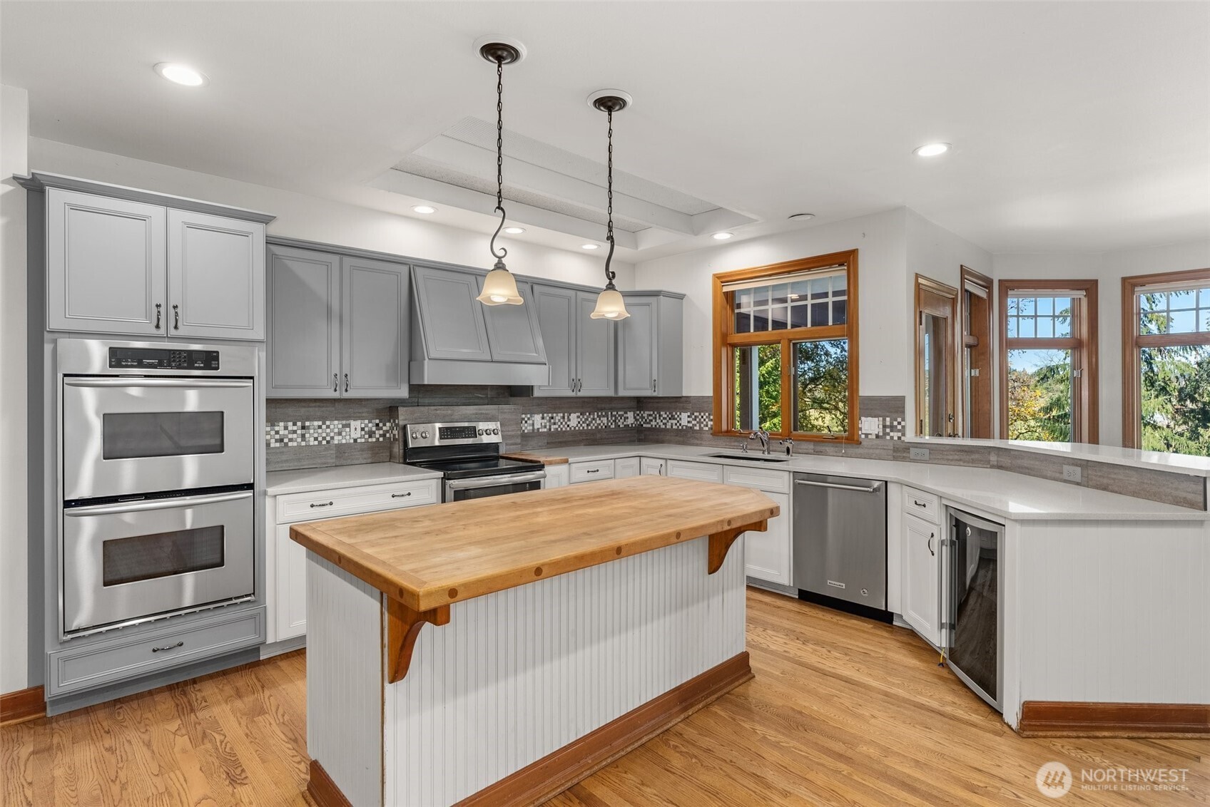 153 A Walhaupt Road Onalaska, WA 98570 - Photo 10 of 38 a large kitchen with stainless steel appliances granite countertop a stove a sink and a microwave