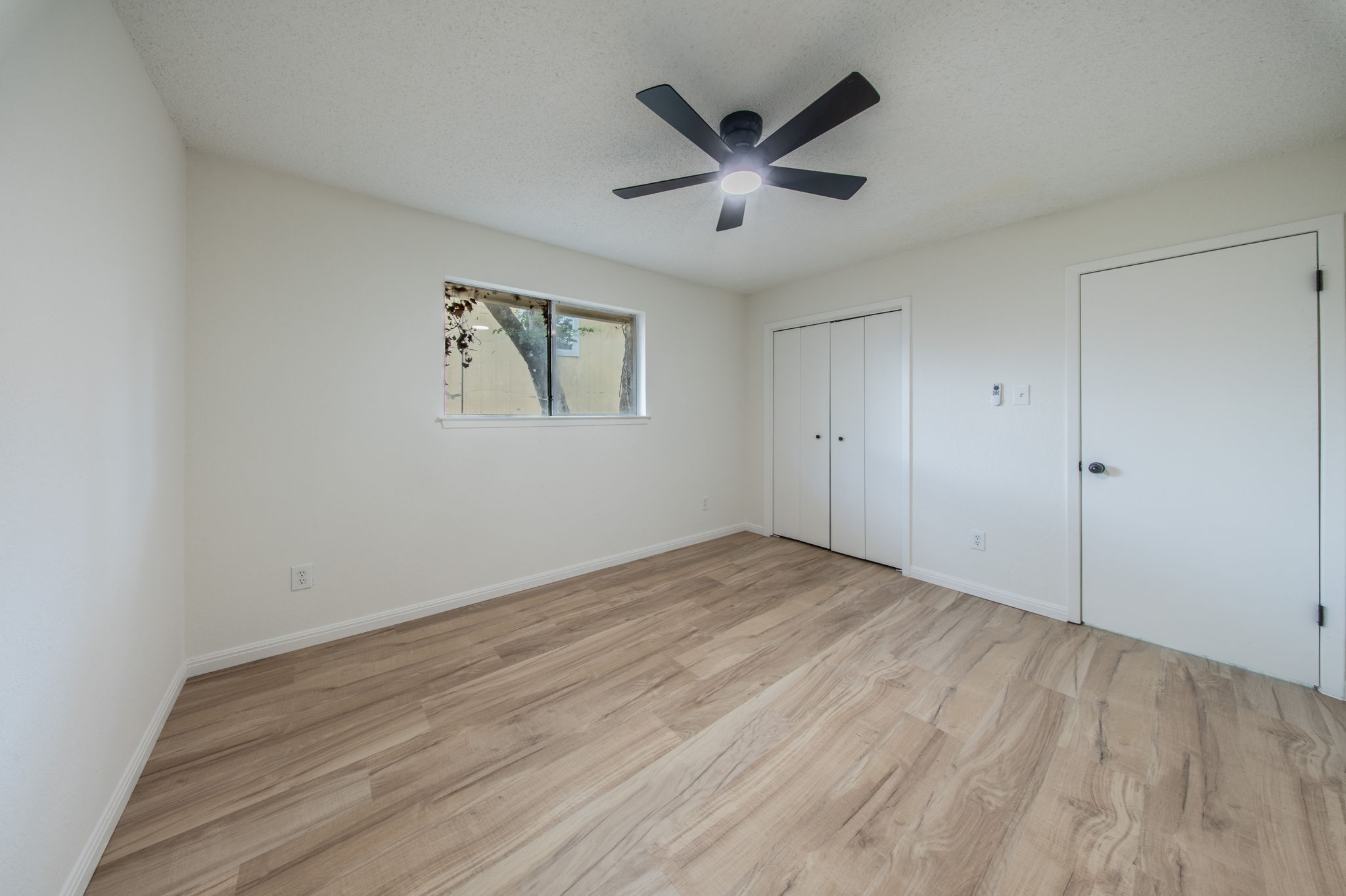 4504 Langtry Lane Austin, TX 78749 - Photo 10 of 24 A quiet retreat with a window offering glimpses of the outdoors and modern wood flooring.