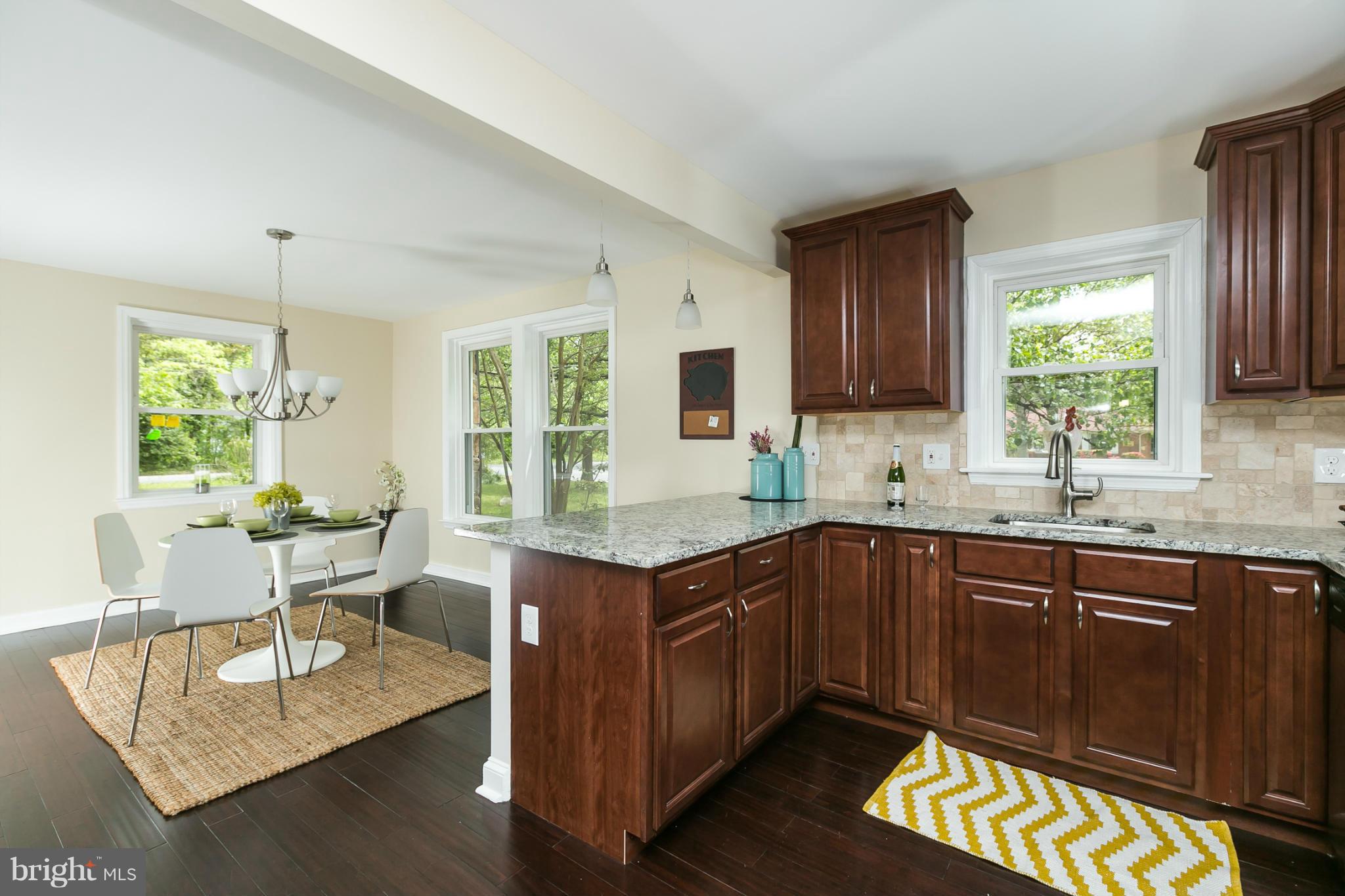 a kitchen with a sink cabinets and window