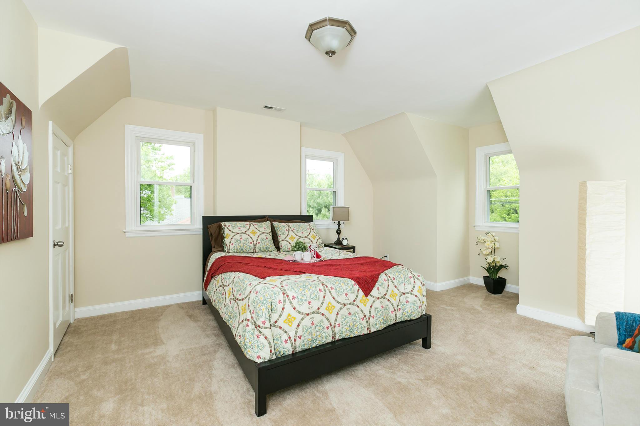 4122 Essex Road Baltimore, MD 21207 - Photo 2 of 30 a bedroom with a bed and window