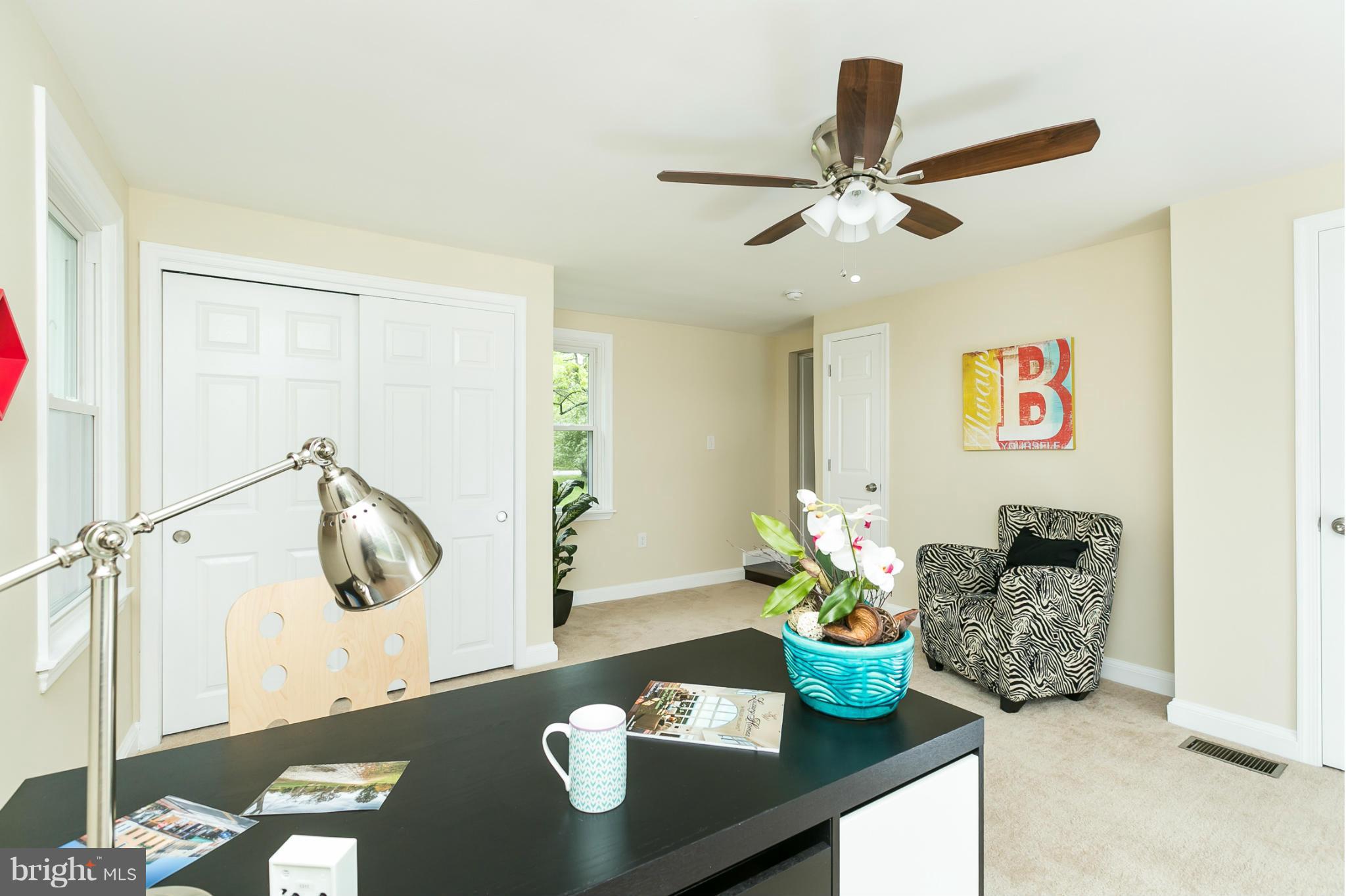 4122 Essex Road Baltimore, MD 21207 - Photo 20 of 30 a living room with furniture and flowers