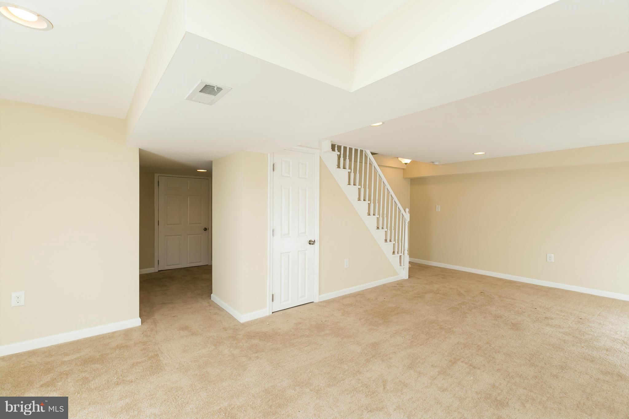 4122 Essex Road Baltimore, MD 21207 - Photo 24 of 30 an empty room with a natural light