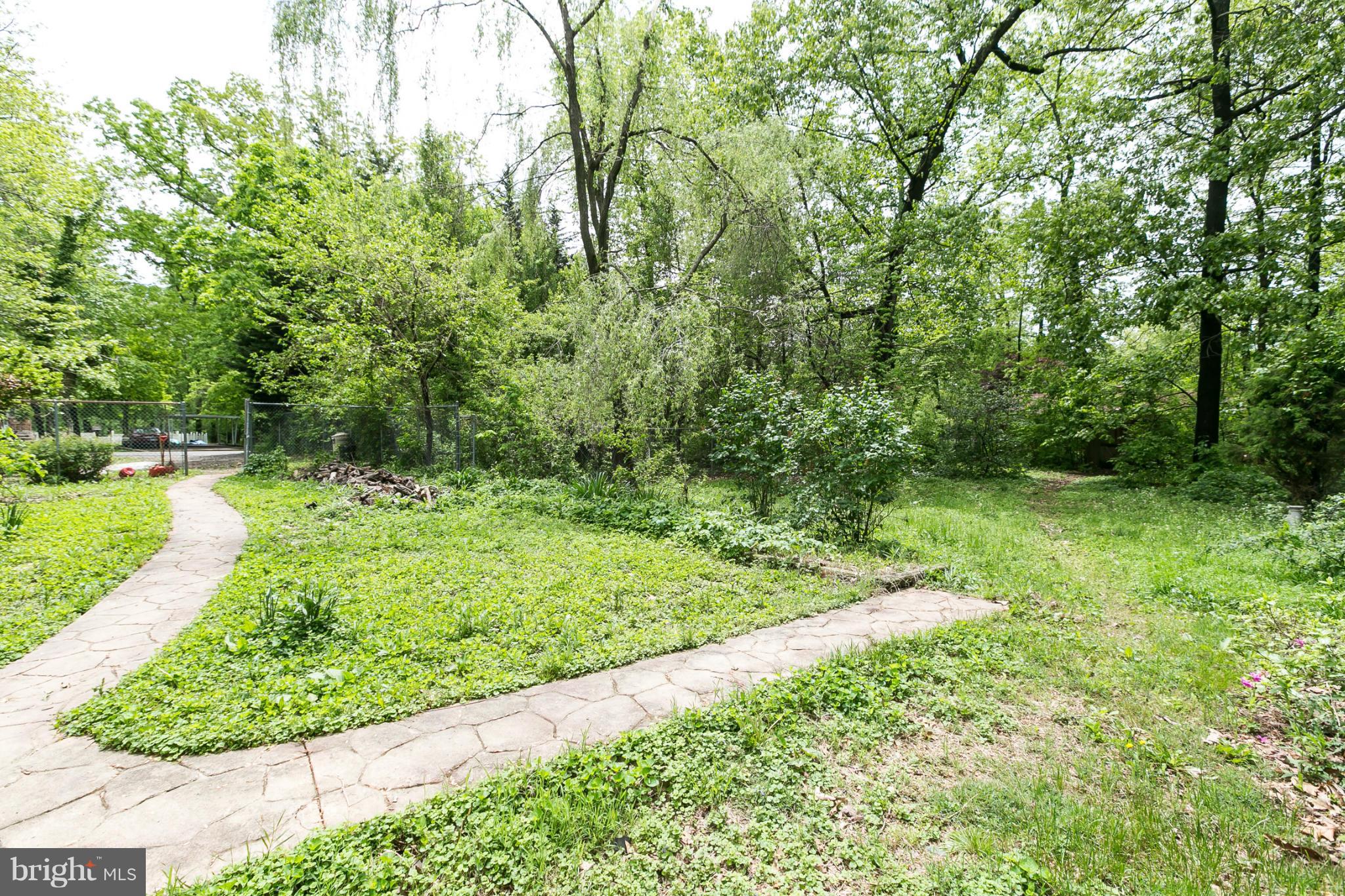 4122 Essex Road Baltimore, MD 21207 - Photo 30 of 30 a view of a garden with a pathway