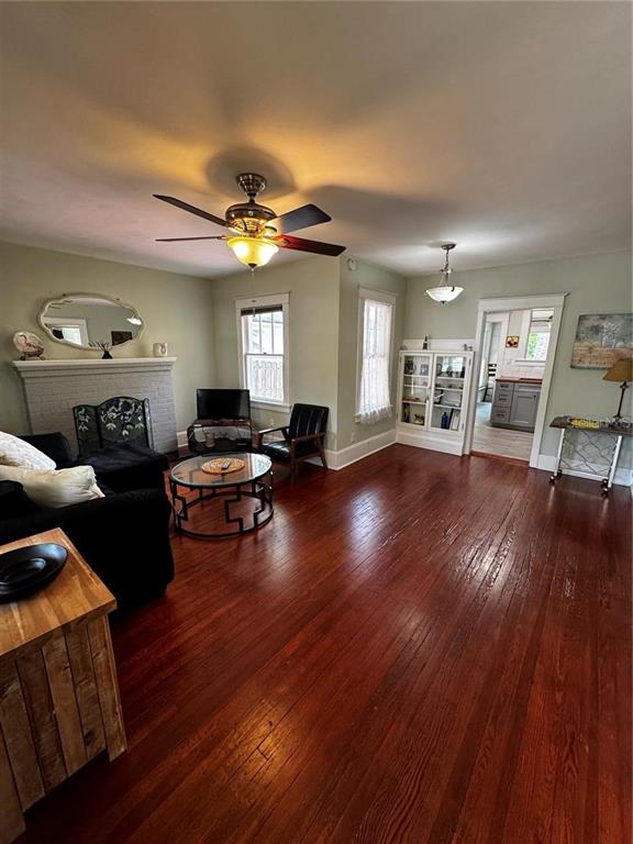 320 North Rhodes Street Mount Dora, FL 32757 - Photo 17 of 33 a living room with furniture dining room and wooden floor