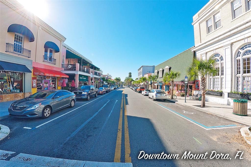 320 North Rhodes Street Mount Dora, FL 32757 - Photo 2 of 33 a car parked in front of a building