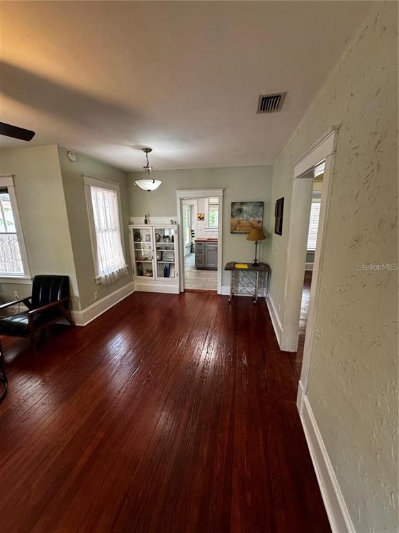 320 North Rhodes Street Mount Dora, FL 32757 - Photo 21 of 33 a living room with hardwood floor and a window