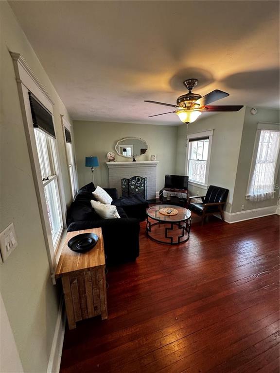 320 North Rhodes Street Mount Dora, FL 32757 - Photo 3 of 33 a living room with furniture window and wooden floor