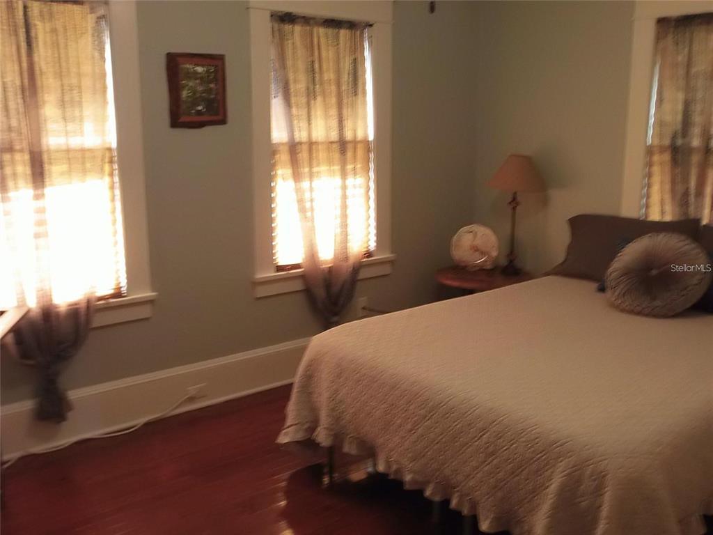 320 North Rhodes Street Mount Dora, FL 32757 - Photo 32 of 33 a bedroom with a bed and window