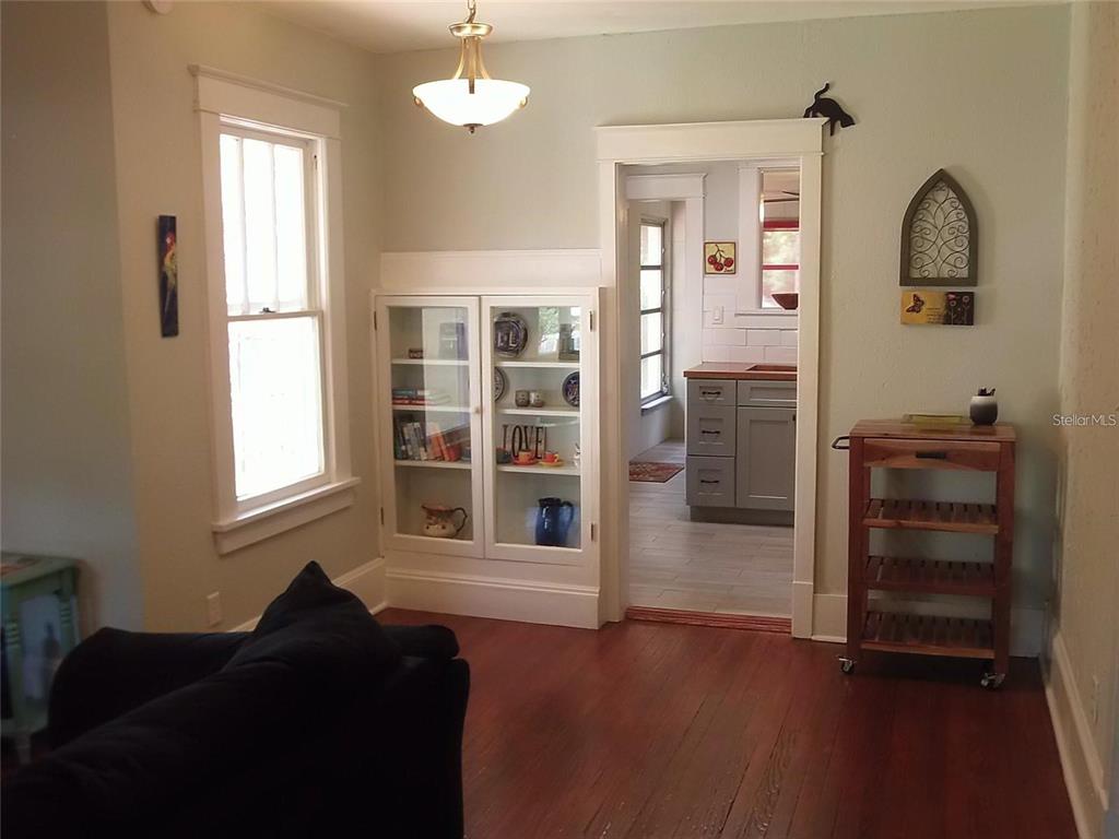 320 North Rhodes Street Mount Dora, FL 32757 - Photo 5 of 33 a living room with furniture and wooden floor