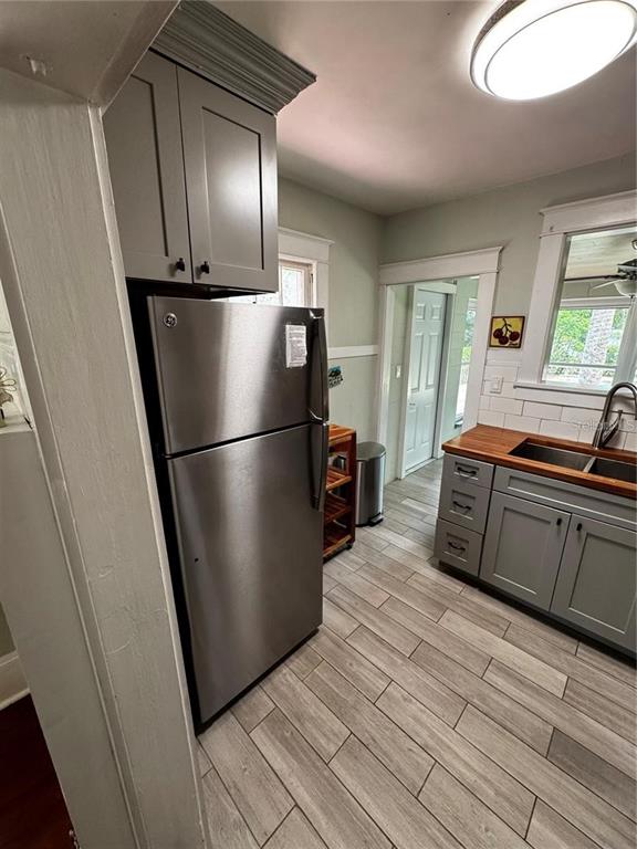 320 North Rhodes Street Mount Dora, FL 32757 - Photo 7 of 33 a kitchen with stainless steel appliances granite countertop a refrigerator a stove and a sink