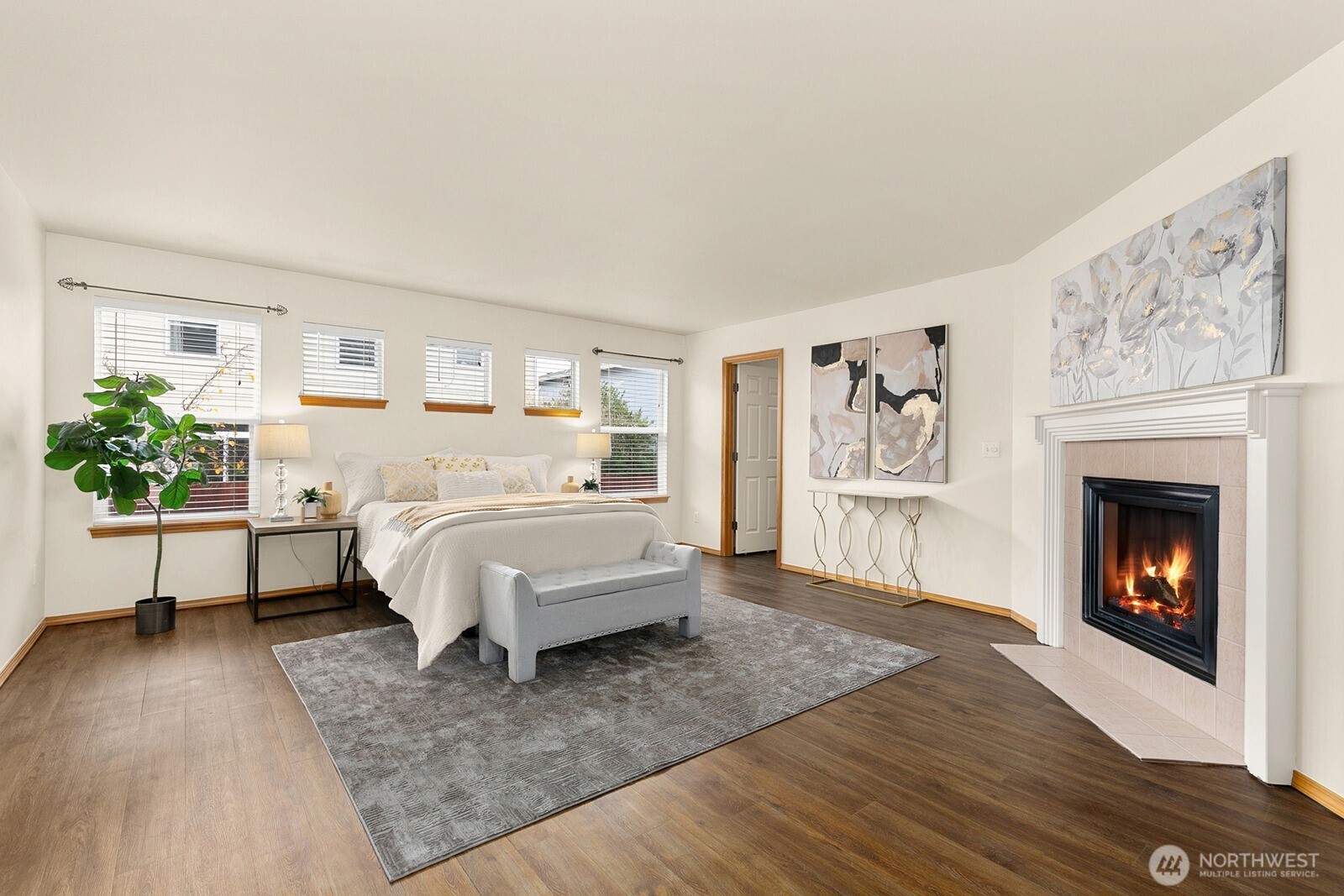 550 Pasco Place Northeast Renton, WA 98059 - Photo 17 of 32 a bedroom with a bed and a fireplace