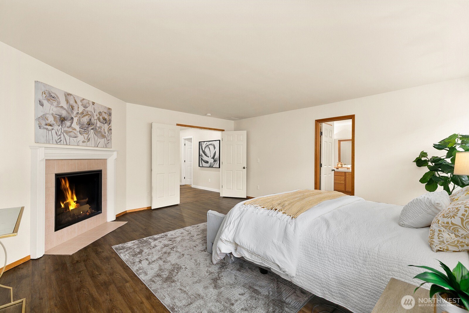 550 Pasco Place Northeast Renton, WA 98059 - Photo 18 of 32 a bedroom with a bed and a fireplace