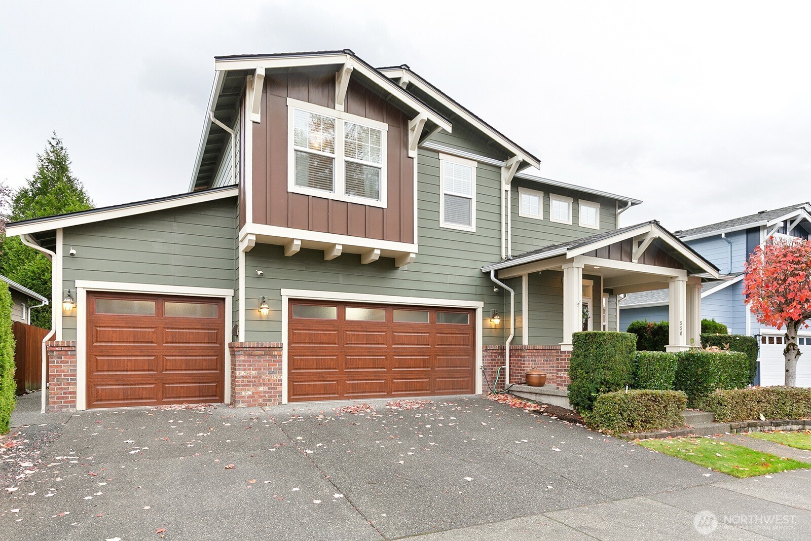 550 Pasco Place Northeast Renton, WA 98059 - Photo 2 of 32 a front view of a house with garage