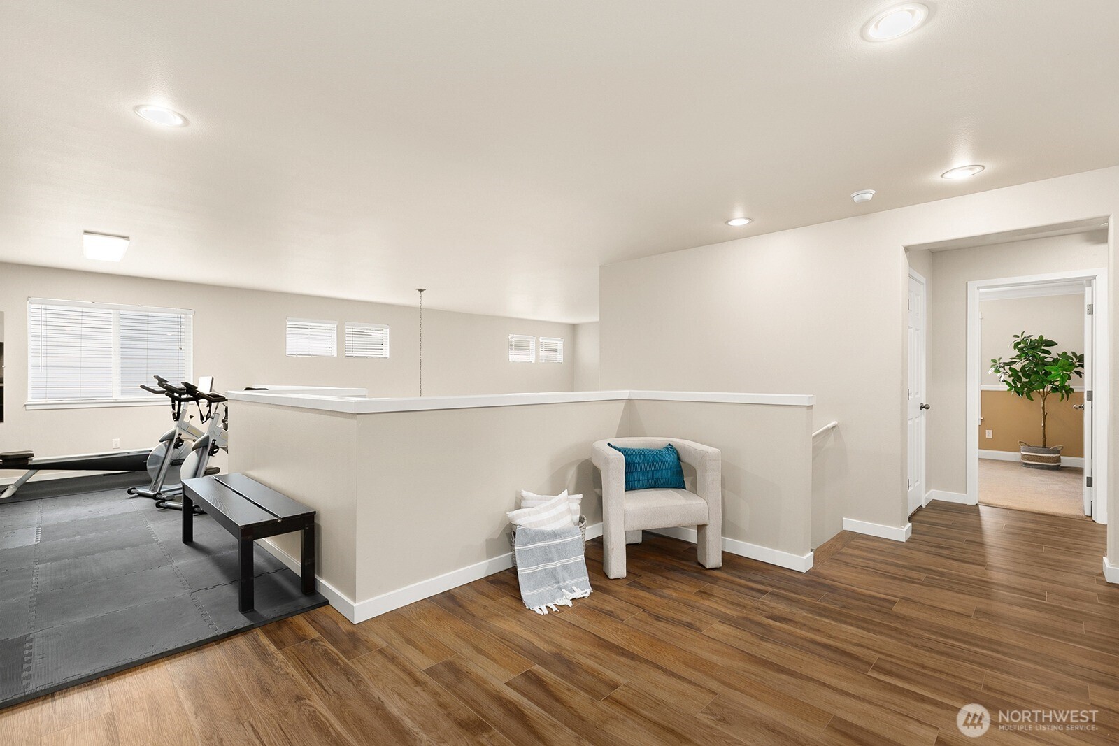 550 Pasco Place Northeast Renton, WA 98059 - Photo 21 of 32 a living room with furniture and a wooden floor