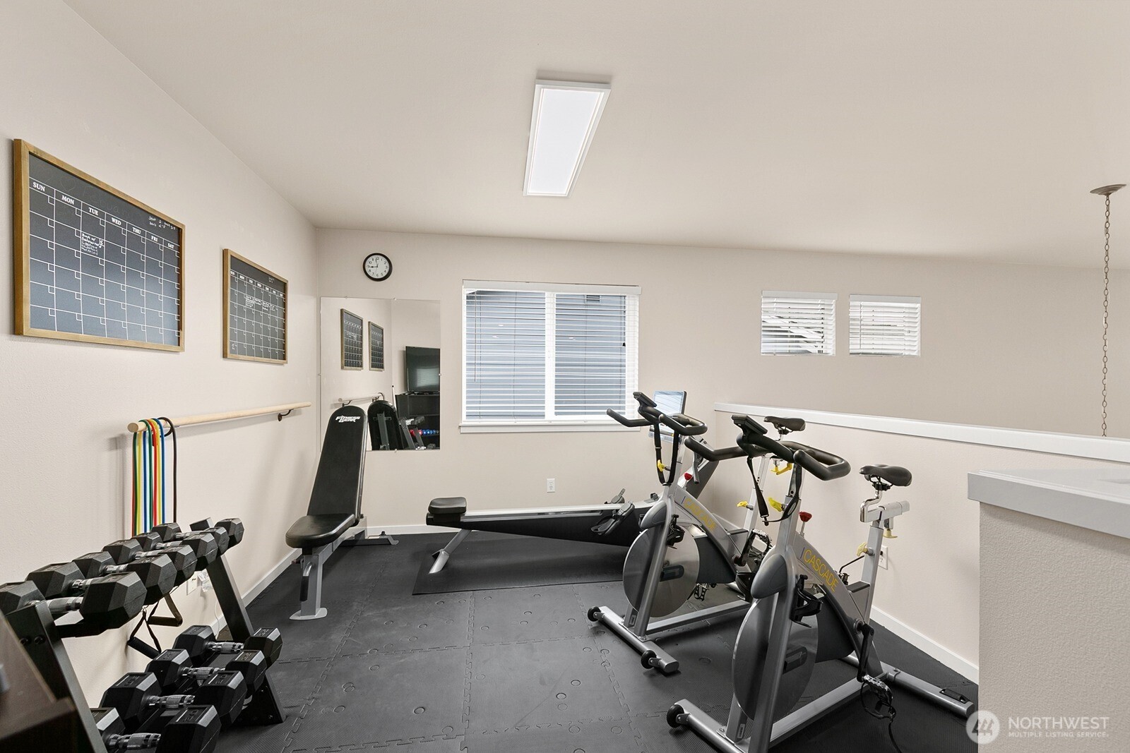 550 Pasco Place Northeast Renton, WA 98059 - Photo 22 of 32 a room with gym equipment and windows
