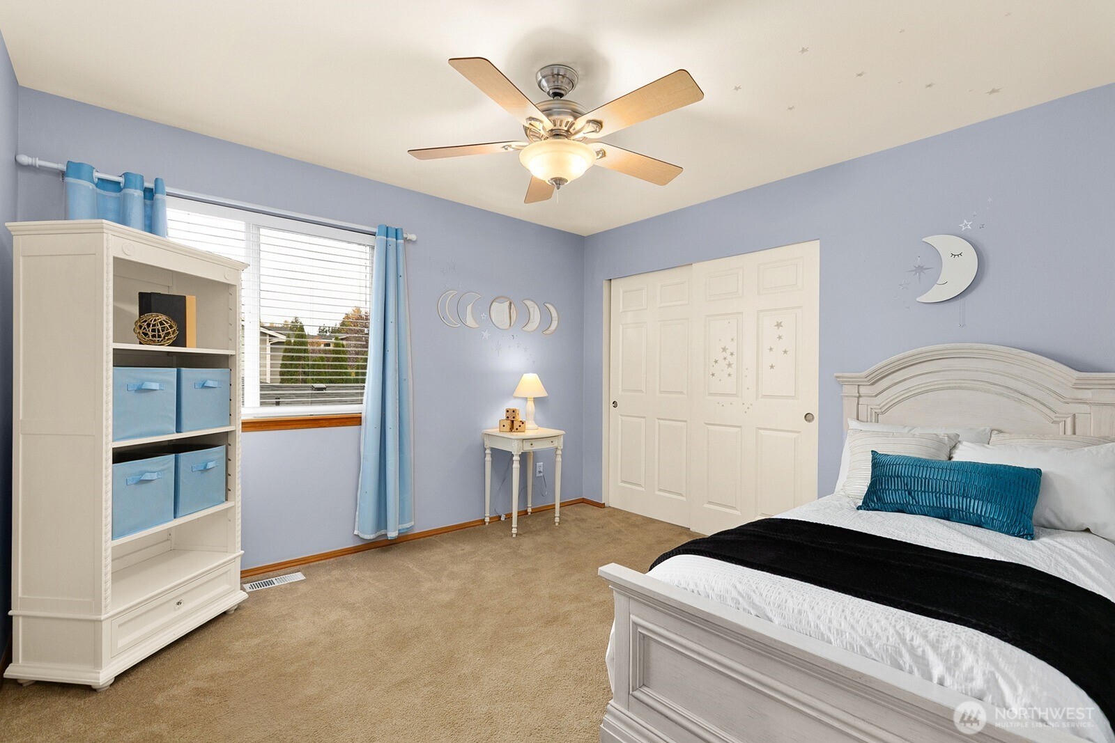 550 Pasco Place Northeast Renton, WA 98059 - Photo 24 of 32 a bedroom with a large bed and a ceiling fan