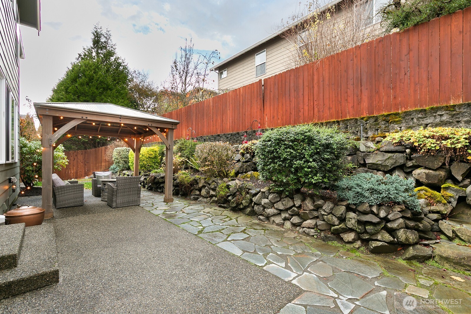 550 Pasco Place Northeast Renton, WA 98059 - Photo 29 of 32 a view of a backyard with sitting area
