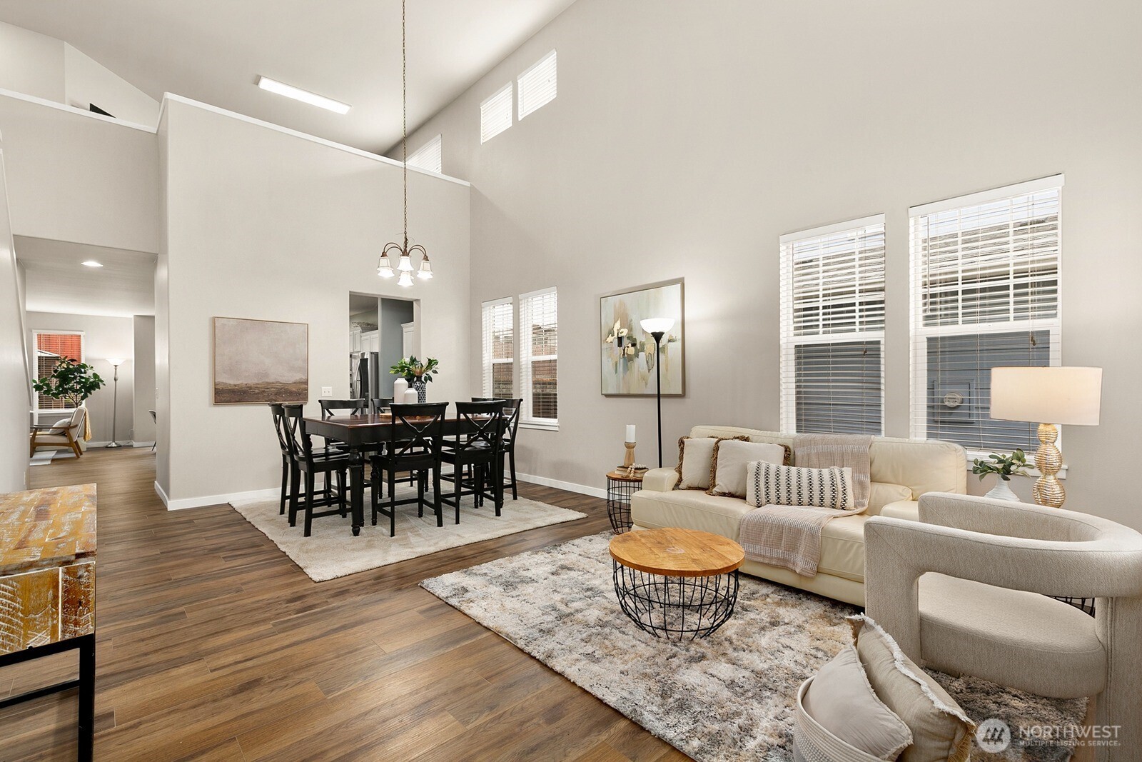 550 Pasco Place Northeast Renton, WA 98059 - Photo 4 of 32 a living room with furniture wooden floor and a large window