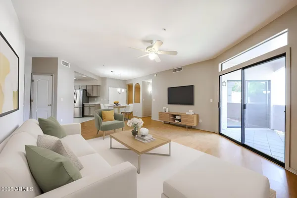 a living room with furniture and a flat screen tv