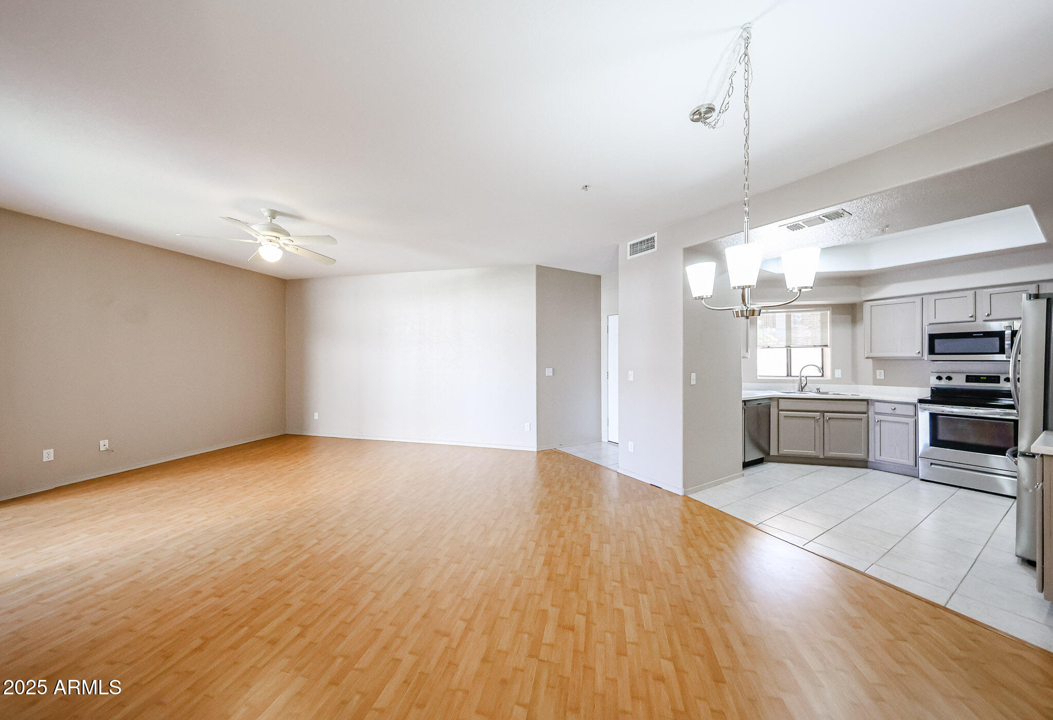 9151 West Greenway Road, Unit 162 Peoria, AZ 85381 - Photo 11 of 37 a view of kitchen with wooden floor
