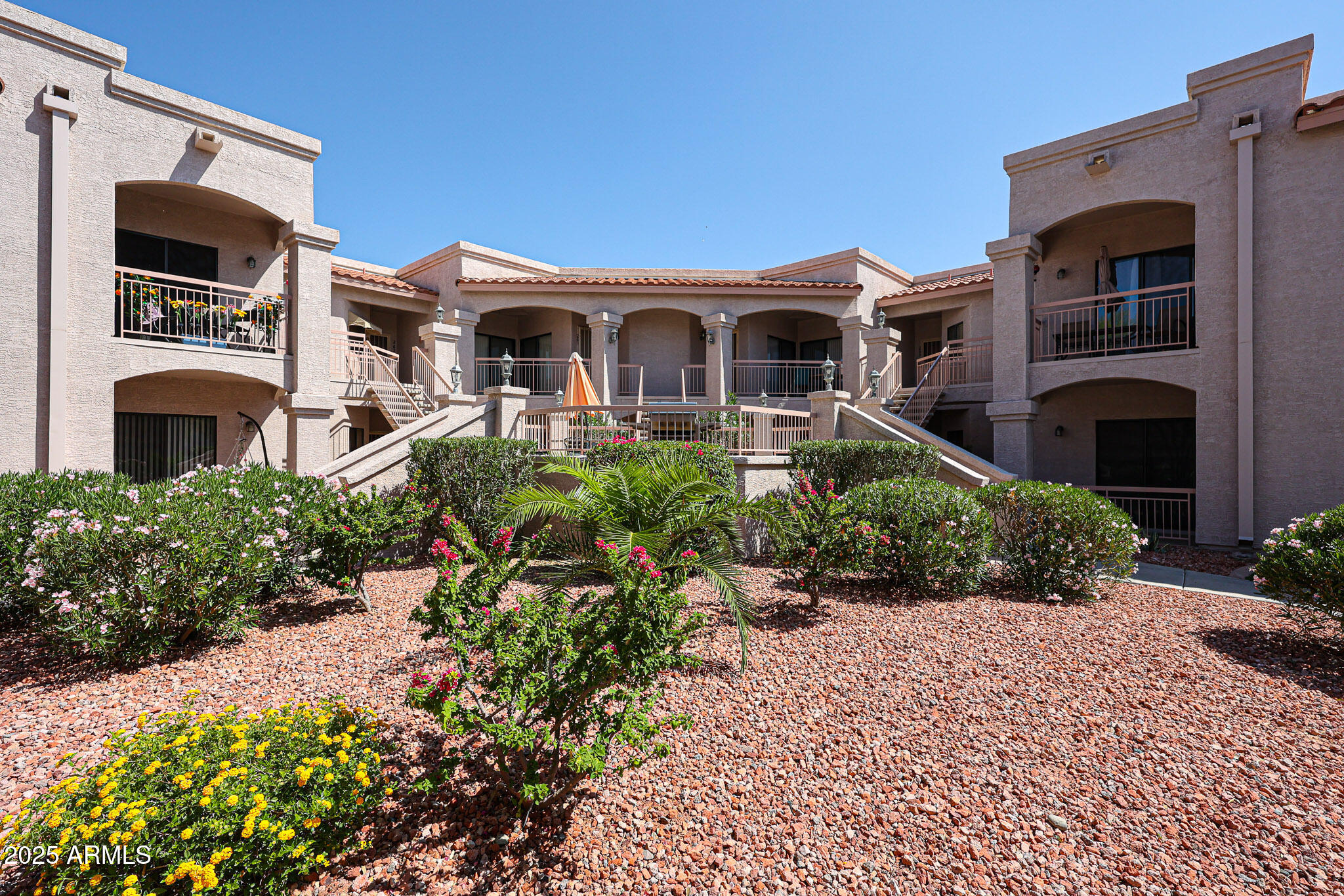 9151 West Greenway Road, Unit 162 Peoria, AZ 85381 - Photo 2 of 37 a front view of a house with a yard